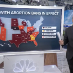 TV host presents data in front of a map on NBC News.