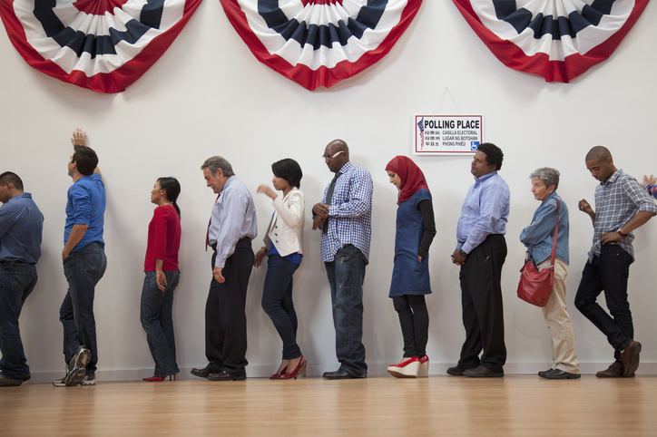 Voters waiting to vote in polling place